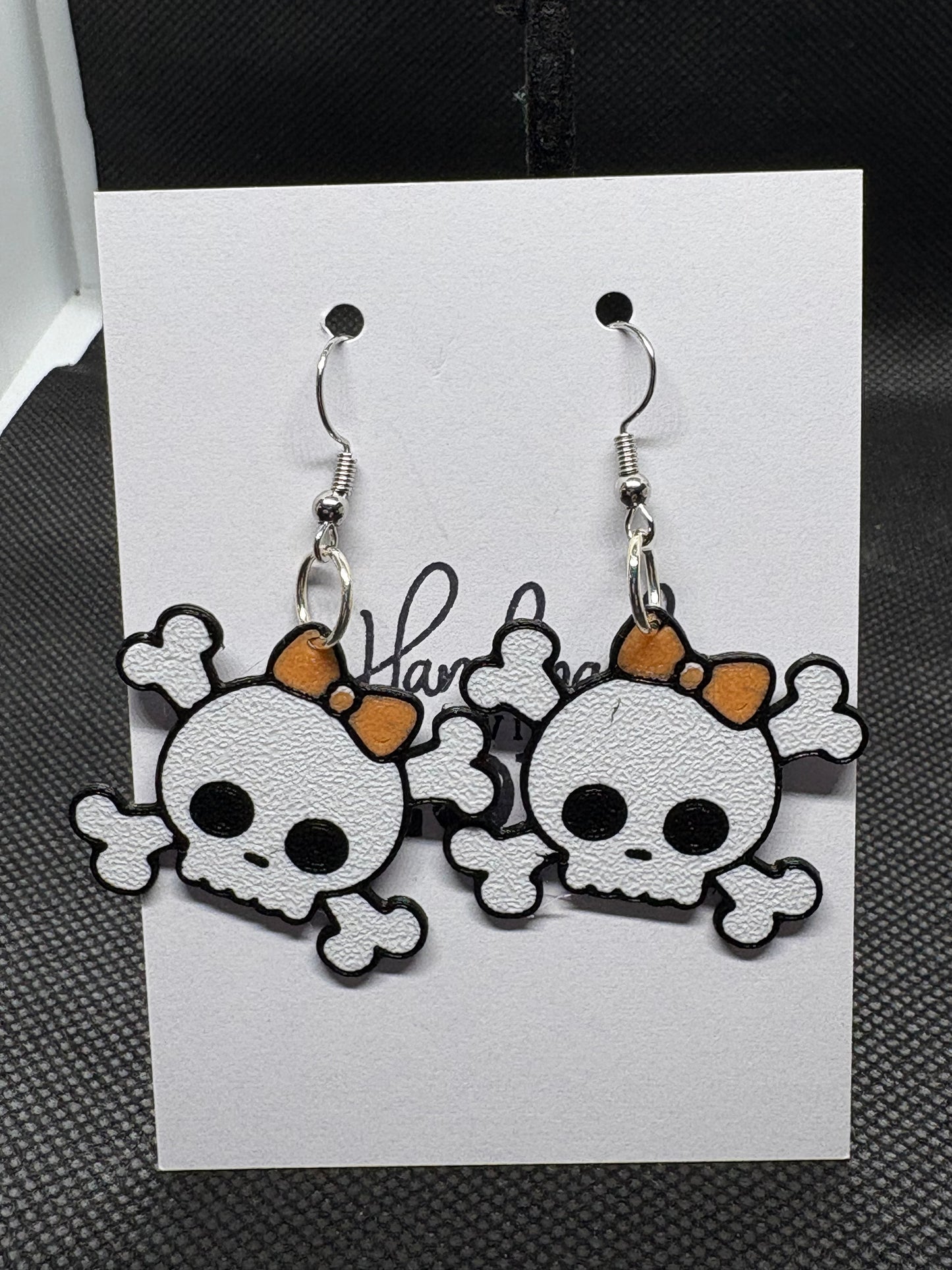 Skull with bow earrings